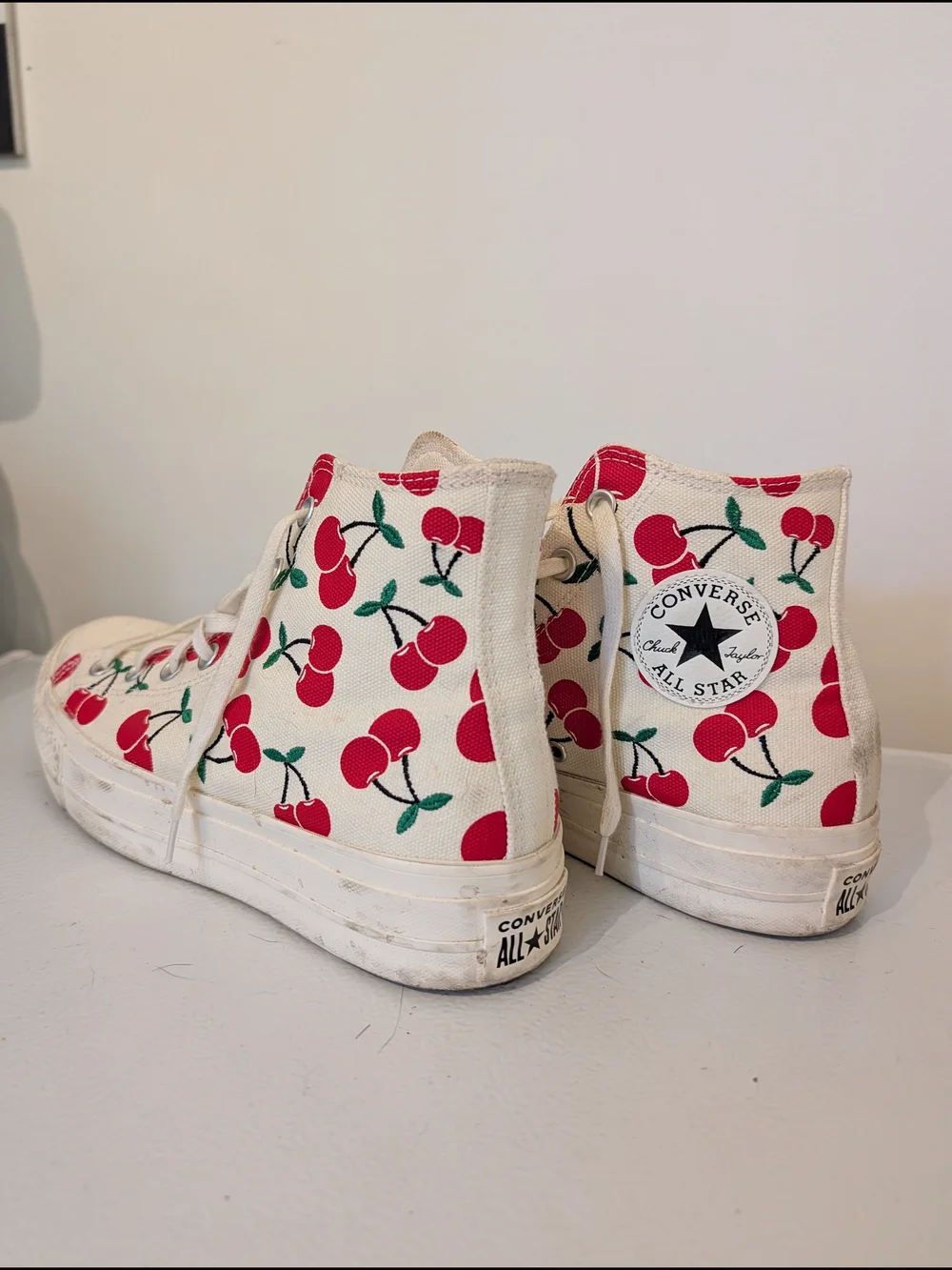 Converse Cream High-Top Sneakers with Red Cherry Accent